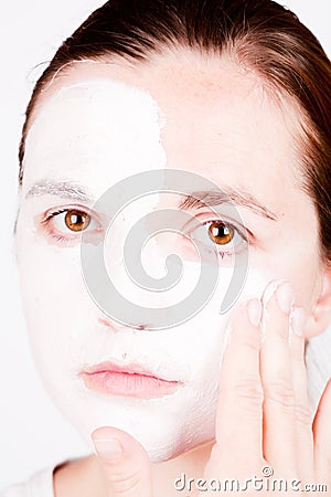 Woman doing cosmetic mask