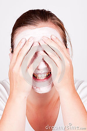 Woman doing cosmetic mask