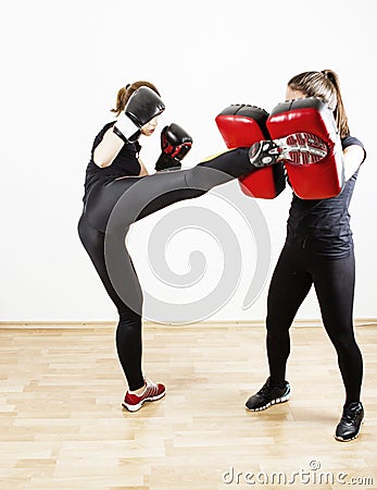 Woman doing kick boxing