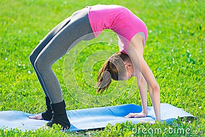 Woman doing stretching fitness exercise. Yoga postures