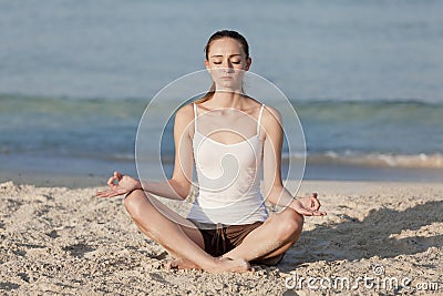 Woman doing yoga on the beach Sports Landscape