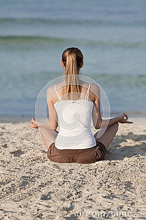 Woman doing yoga on the beach Sports Landscape