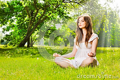 Woman doing yoga in spring park