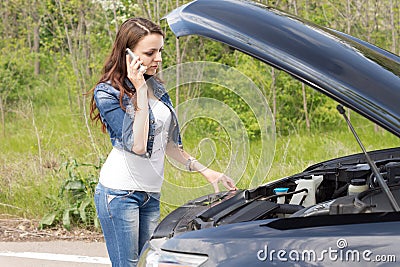 Woman driver calling for breakdown assistance