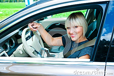 Woman driver with car key