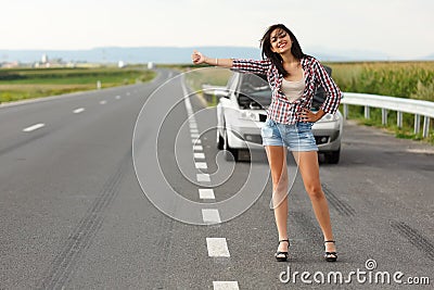 Woman driver hitch-hiking