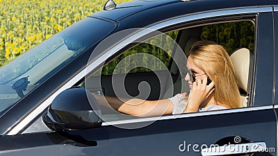 Woman driver talking on her mobile