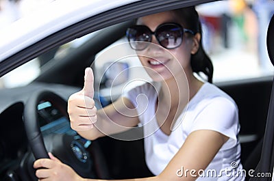 Woman driver thumb up