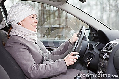 Woman driving a car looking forward