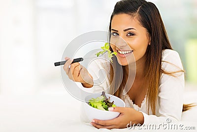 Woman eating salad