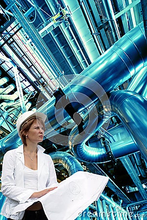 Woman engineer against pipes