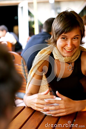 Woman enjoying conversation at coffee