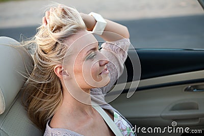 Woman enjoying driving cabriolet