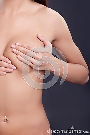 Woman examining breast mastopathy or cancer