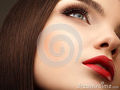 Woman Eye With Beautiful Makeup and Long Eyelashes. Red Lips. Hi