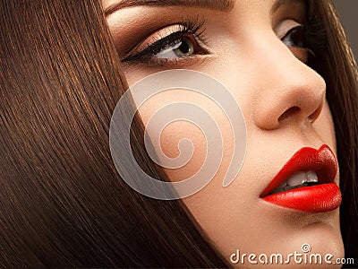 Woman Eye with Beautiful Makeup. Red Lips. High quality image.