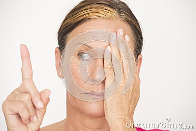 Woman Eyesight focus test on finger