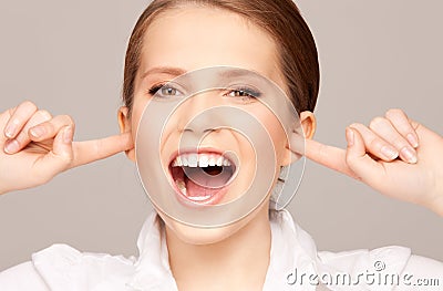 Woman with fingers in ears