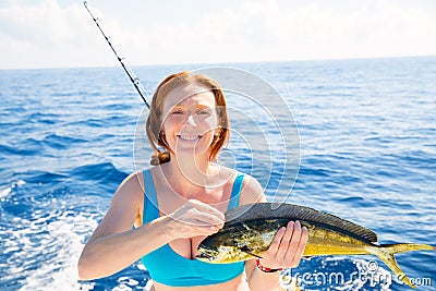 Woman fishing Dorado Mahi-mahi fish happy catch