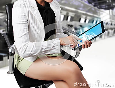 Woman foreground with tablet in her hands