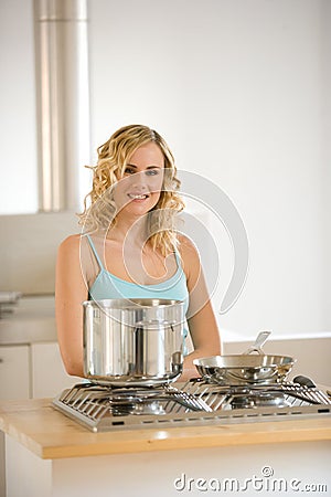 Woman in front of a kitchen