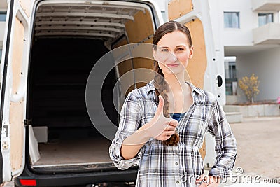 Woman in front of moving truck