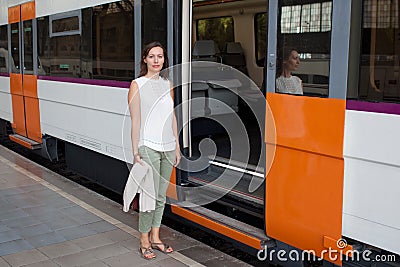 Woman in front of train