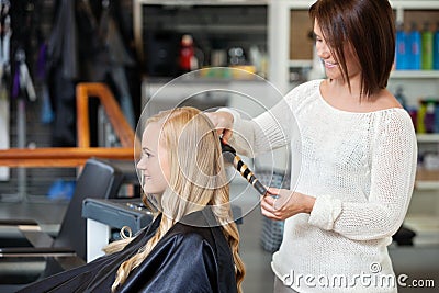 Woman Getting Her Hair Curled