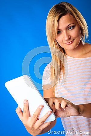 Woman girl using tablet touchpad reading e-book e-reader on blue