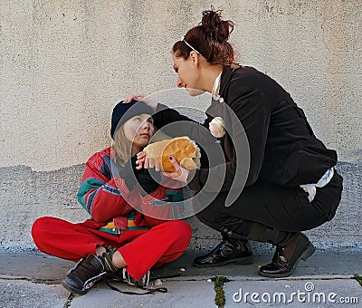 Woman gives bread a beggar child