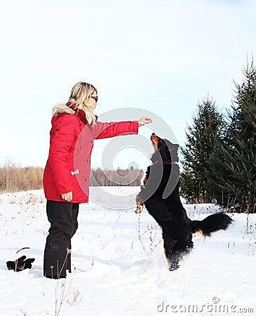 Woman giving treats to dog