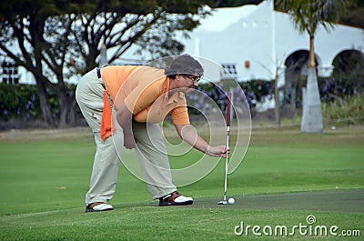 Woman golf putting green