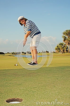 Woman golfing