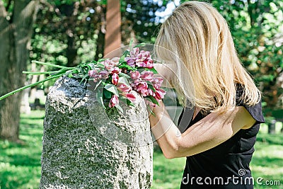 Woman Grieving at Grave