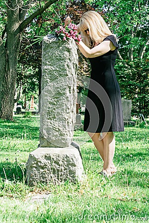 Woman Grieving at Grave