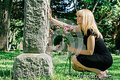 Woman Grieving at Grave