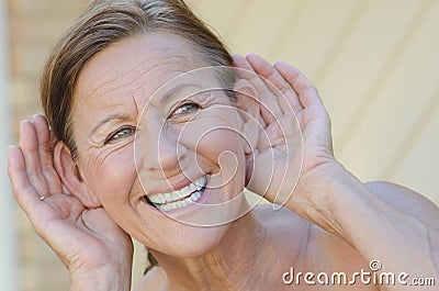 Woman hand to ear listening isolated outdoor III