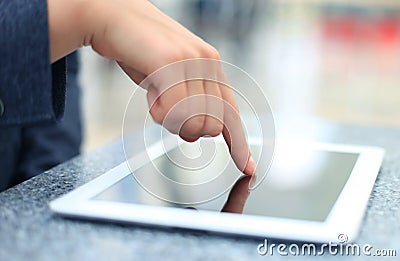 Woman hand touching screen on modern digital tablet pc