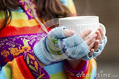 Woman hands with cup
