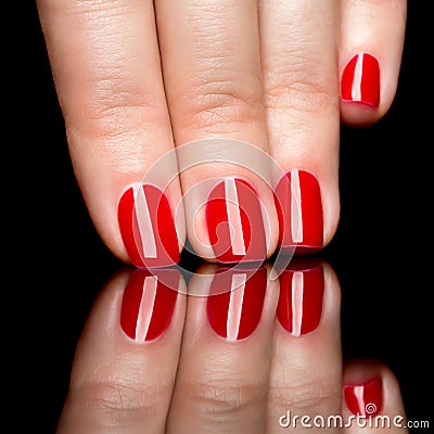 Woman hands with manicured red nails closeup.