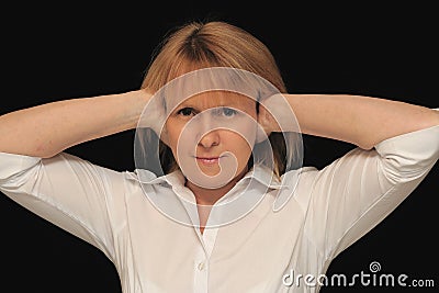 Woman with hands over ears