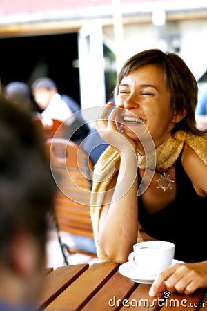 Woman in a happy conversation at coffee