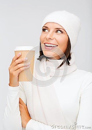 Woman in hat with takeaway tea or coffee cup