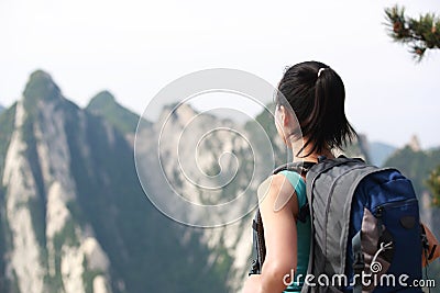 Woman hiker mountain peak