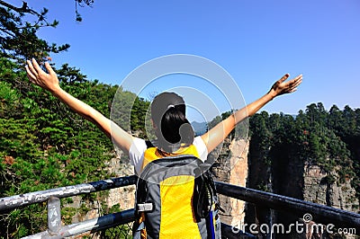 Woman hiker open arms