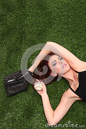 Woman Holding Baseball Sports Gear on Grass