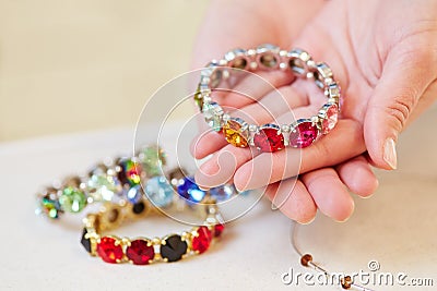 Woman holding bracelet in jewelry