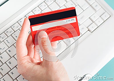 Woman holding a credit card for