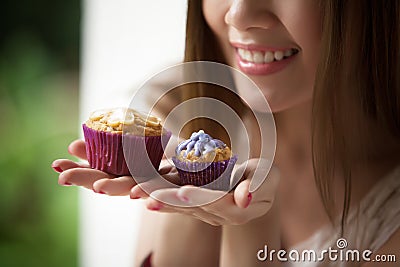 Woman holding a cup cake