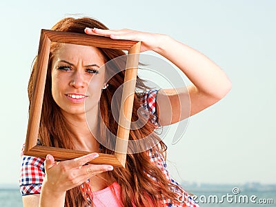 Woman Holding Frame travel concept